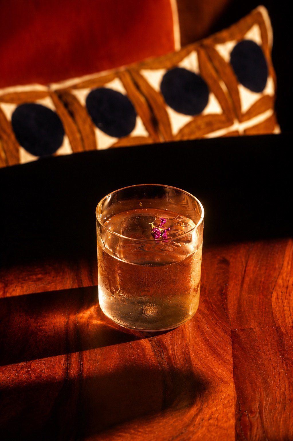 Clarified Chilcano cocktail in dramatic golden light